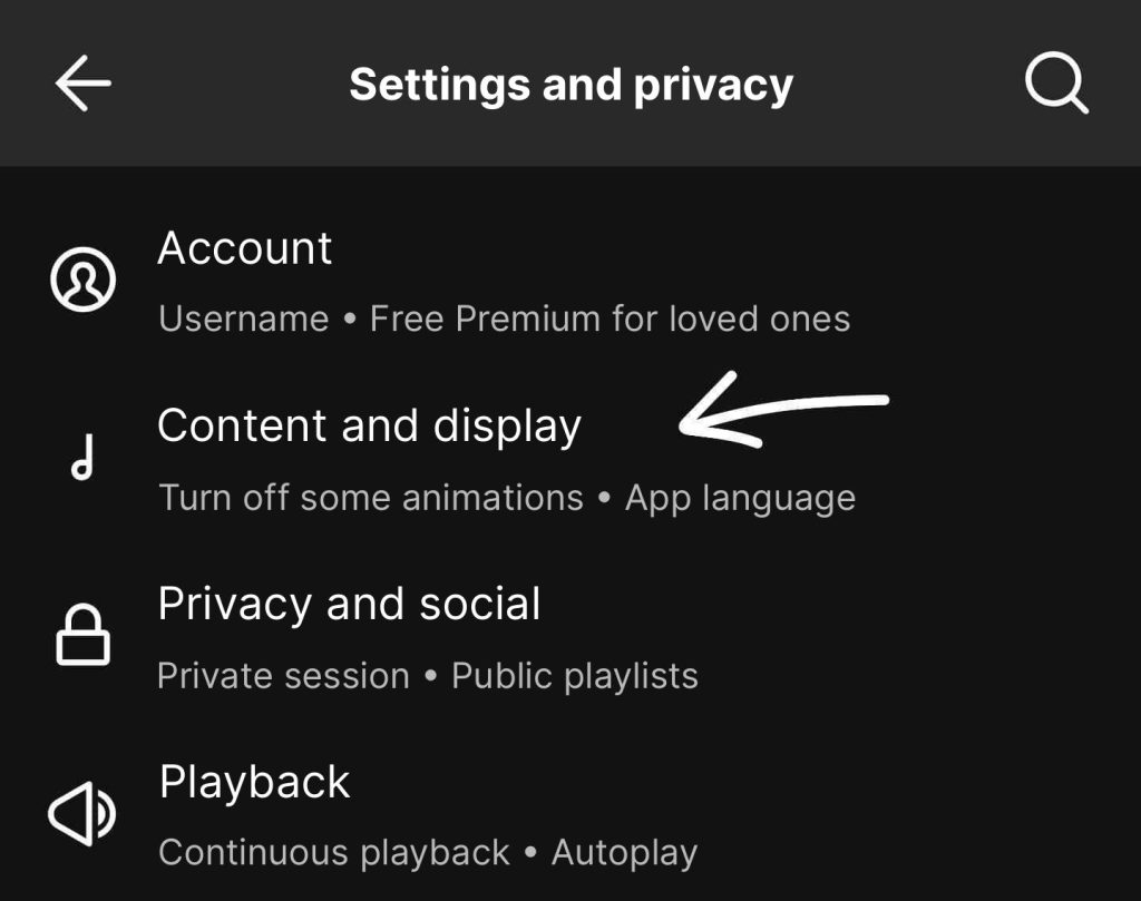 Snímka obrazovky predvolieb Spotify: sekcia „Obsah a zobrazenie“, so šípkou na Canvas