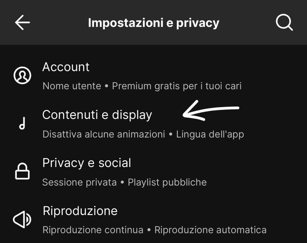 Screenshot delle preferenze di Spotify: sezione Contenuti e visualizzazione, con una freccia che indica Canvas